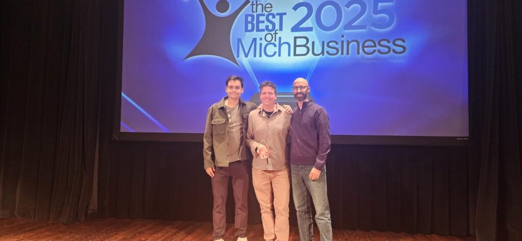 Arcminute Marketing on stage with other award winners at the 2025 Best of MichBusiness Awards