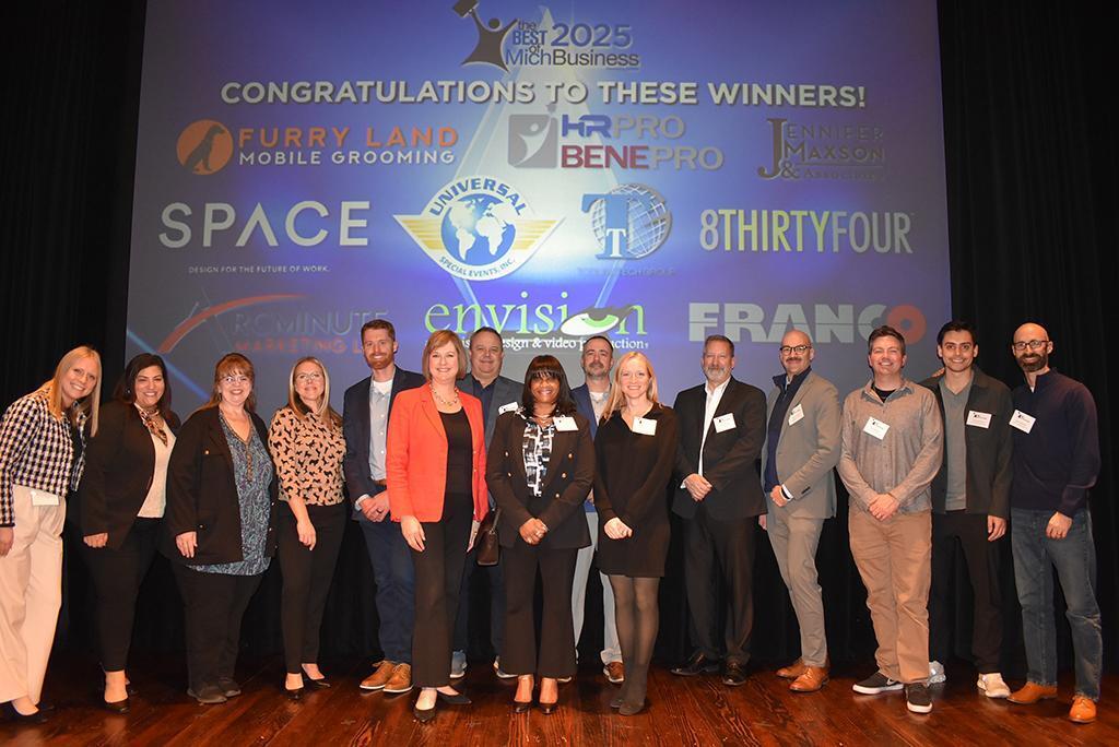Arcminute Marketing on stage with other award winners at the 2025 Best of MichBusiness Awards